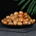 Polished honey yellow citrine tumble stones displayed in a black decorative bowl - Red Dongling 2-3cm 100g