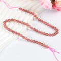Polished strawberry quartz round beads on a pink cord for DIY jewelry making - 6mm (Medium)