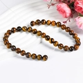 Natural tiger eye 10mm round stone beads with polished brown chatoyancy effect - 10mm