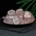 Bulk rose quartz tumbled stones in a black tray for home decor and crystal healing - High-quality Rose Quartz Shaped And Polished To 2-3cm.