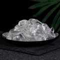 Polished clear quartz tumbled stones displayed in a black bowl for crystal healing - Clear Quartz Crystal Irregularly Polished 2-3cm
