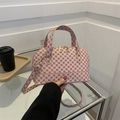 Pink shell handbag with vintage geometric patterns and golden metal hardware detail - Pink