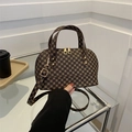 Vintage brown monogram shell handbag with leather texture and gold hardware detailing - Brown