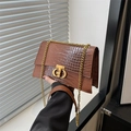 Dark brown crocodile pattern handbag with gold chain strap and metallic twist lock - Irregular Metal Twist Lock Style / Brown