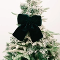 Elegant dark green velvet bow ornament hanging on a festive Christmas tree - Medium / Green