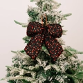 Sparkling red sequin Christmas bow pendant hanging on a snow-covered pine branch - Small Black