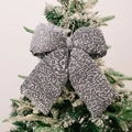 Sparkling silver grey sequin bow pendant hanging on a snowy green Christmas tree branch - Large Gray