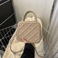 Beige quilted square handbag with gold hardware and top handle for fashion styling - Khaki