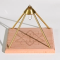 Clear crystal vogel point in a gold pyramid frame on an engraved wooden base - Lotus Shape / Small