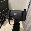 Elegant black lychee leather shoulder bag with silver twist lock and minimalist design - Black