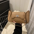 Elegant tan lychee leather shoulder bag with silver turn-lock and minimalist design - Khaki