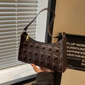 Deep brown embossed underarm bag with vintage star pattern and gold hardware zipper - Coffee