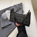 Elegant black underarm bag with star-shaped quilting and gold zipper for women - Black