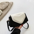 Minimalist black and white contrast crossbody bag with 3D heart-shaped embossed detail - Black