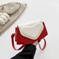 Chic red and white color-block crossbody bag featuring a large 3D heart embossed detail - Red