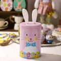 Pink Easter bunny tin box with soft fabric ears and floral bow for holiday candy storage - Pink