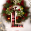 Christmas tree letter L ornament with red plaid fabric and festive pine cone accents - Letter L
