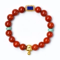 Red agate bracelet with golden zodiac pig charm and turquoise beads on white background - Zodiac Snake