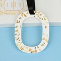 Oval white gypsum aromatherapy tablet with citrine crystals and a black satin ribbon - Cologne (Citrine)