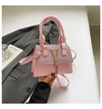 Chic pink leather crossbody bag with V-shaped gold logo and fringe tassel detail - Pink