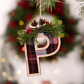 Christmas plaid letter P ornament with pine needles and berries hanging on a rustic hemp rope - Letter P
