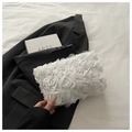 Macro shot of 3D white chiffon roses and metal zipper detail on small evening clutch bag - White
