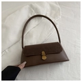 Detail of minimalist dark brown leather underarm bag with gold clasp and suede flap texture - Dark Brown