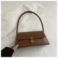 Detail of leopard print flap and vintage gold metal clasp on brown leather handbag - Tan