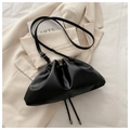 Chic black drawstring handbag with rivet details and adjustable leather shoulder strap - Black