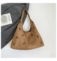 Brown faux suede tote bag with laser-cut floral patterns and a minimalist hobo design - Brown