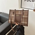 Classic brown plaid tote bag with leather trim and dual straps in a modern room - Brown Plaid / Brown