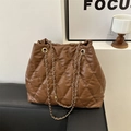 Deep brown quilted bucket bag with gold chain strap and elegant diamond lattice texture - Brown