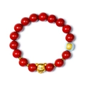 Red cinnabar bead bracelet featuring a golden pig zodiac charm and light blue accent bead - Pig