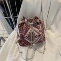 Ethnic style geometric woven bucket bag with silver chain and pearl accent detail - Red