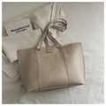 Close-up of beige tote bag with litchi grain texture and Fashion label detail - Dark Khaki