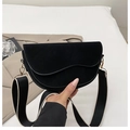 Minimalist black suede saddle bag with wide fabric strap and gold-tone hardware detail - Black
