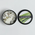Scented soy candle in black tin with lemongrass fragrance and dried botanical elements - Lemongrass