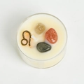 Scented soy candle in glass featuring Leo zodiac symbol and natural raw gemstones - Leo