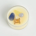 Handmade Gemini soy candle in a glass jar with blue and yellow raw gemstones - Gemini