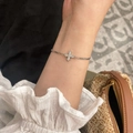 Double-layer silver cross bracelet with zircon inlay worn on wrist for fashion look - Double Layer Cross Style
