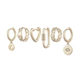 Détail d'un lot de 6 boucles d'oreilles dorées avec pendentifs étoile, cœur et mauvais œil - Ensemble Cœur Mauvais Œil Or