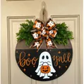Detail of wooden Halloween door hanger with ghost pattern and 'BOO Y'ALL' text art - Ghost with Lantern