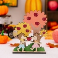 Wooden Thanksgiving table ornament featuring hedgehogs sharing apples under a tree - Hedgehogs Sharing Apple Style A