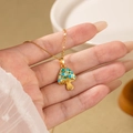 Chic mushroom pendant necklace with colorful enamel dots on a gold thin link chain - Blue and Green Mushroom