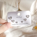 Detailed view of silver heart earrings with white opal stones on 925 post card - Heart Stud Earrings 6-Piece Set - Platinum