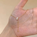 Elegante collana a Y dorata con perline rotonde e un ciondolo in zircone a forma di goccia - Collana con Nappina a Goccia / Oro