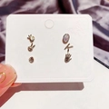 Close-up of a 6-piece gold earring set featuring hand gestures and zircon on a display card - Gesture Palm Stud Earring Set