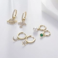 Detailed close-up of six-piece asymmetric gold earring set with celestial zircon charms - Universe Star Moon Earrings 6-Piece Set