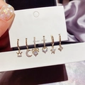 Detail of six-piece gold earring set with zircon moon and star motifs on silver posts - Star Moon Zircon Earring Set