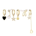 Detail of 6-piece gold earring set featuring stars, pearls, heart, and fringe tassels - Black Heart Pearl Earring Set